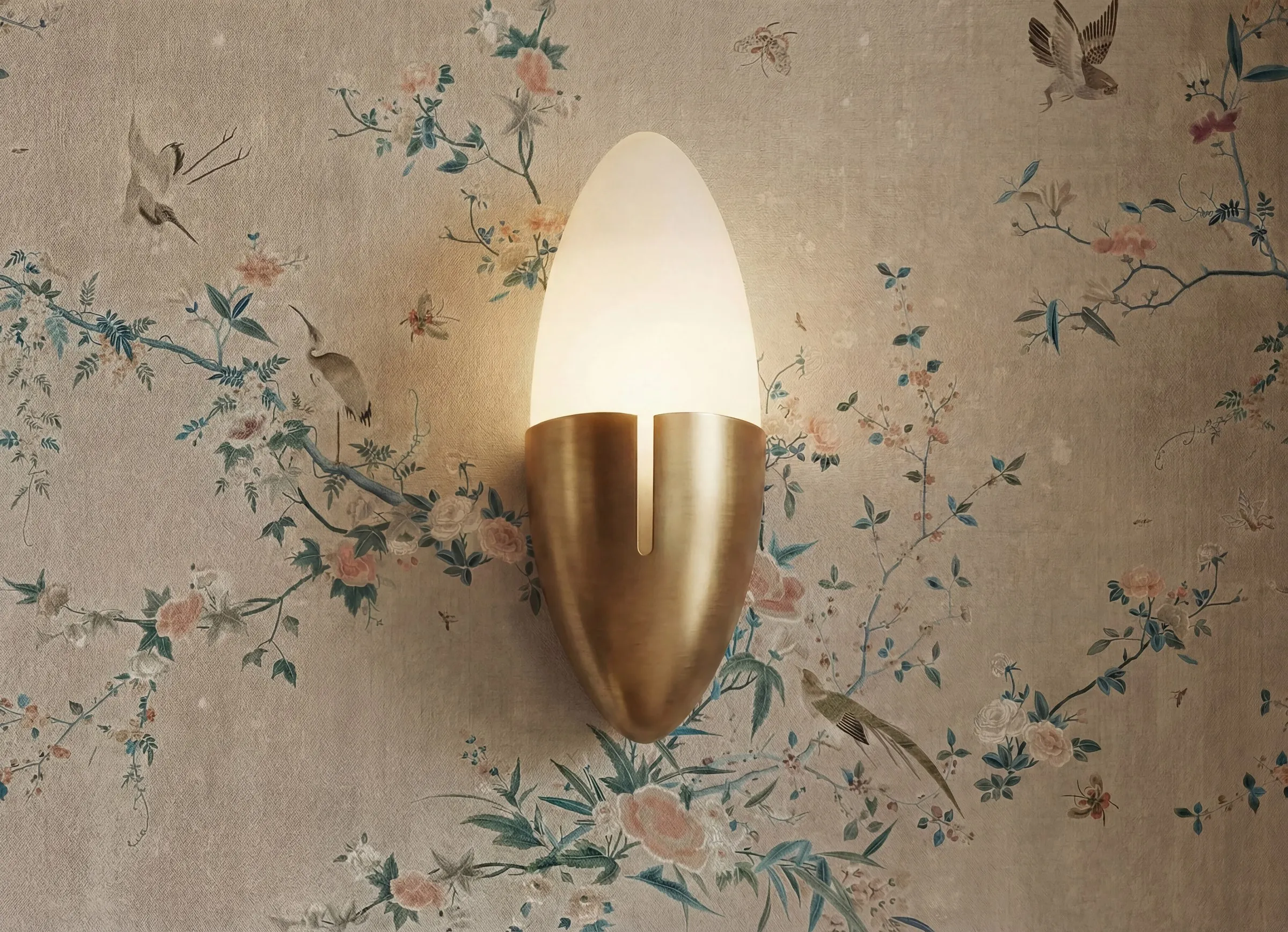 Brushed brass wall light on the chinoiserie papered dining room wall