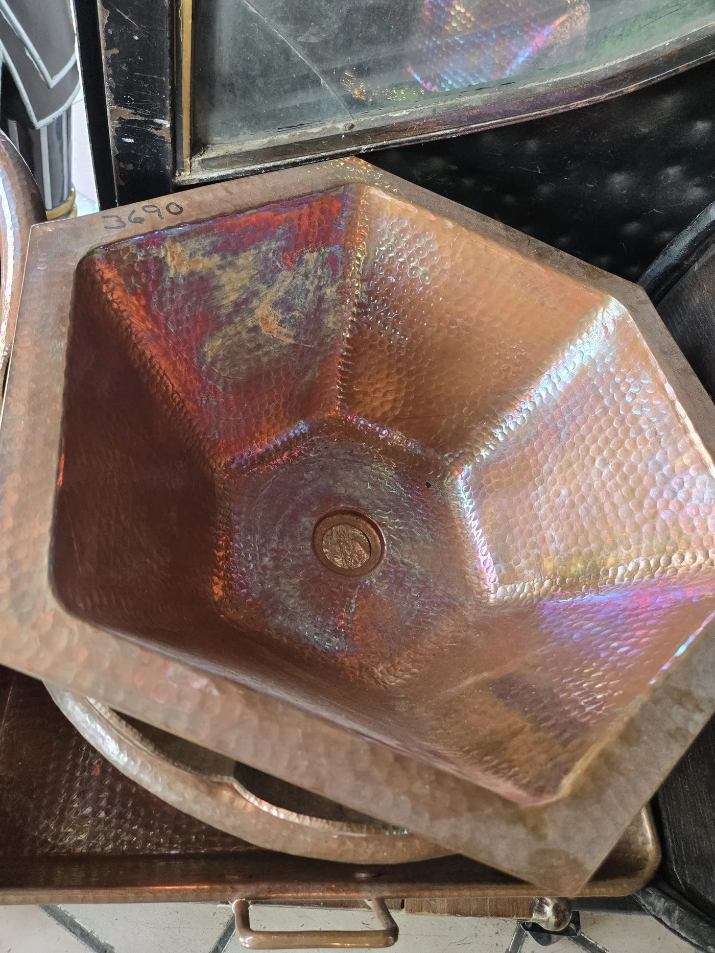 Hand-beaten copper sink sourced from Mexico for the tiny house kitchen